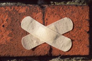 a bandaid on a brick